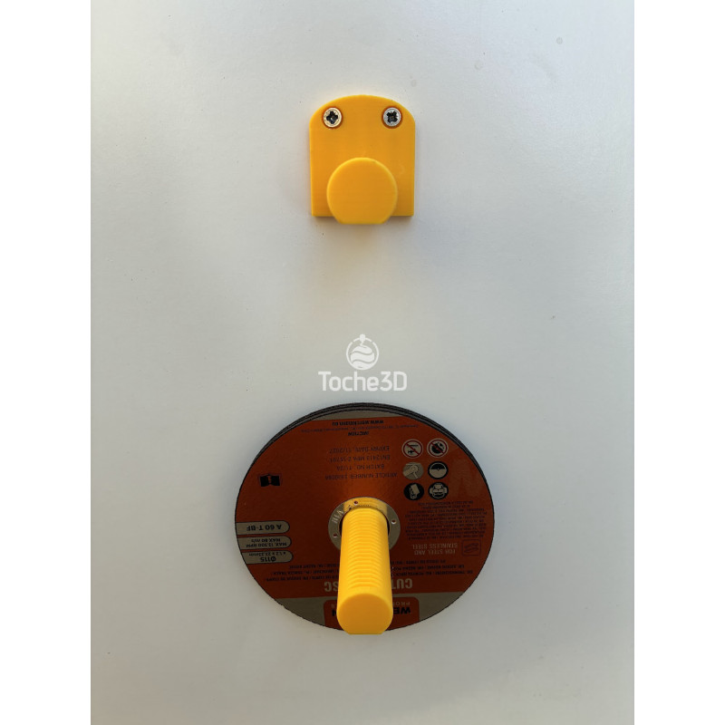 Support mural DeWalt vu de dessus, avec un disque de meuleuse installé en dessous